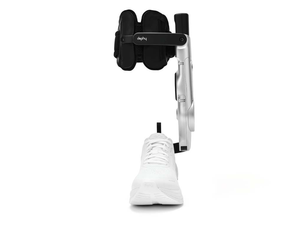 White sneaker being measured with a black and Sidekick on a white background